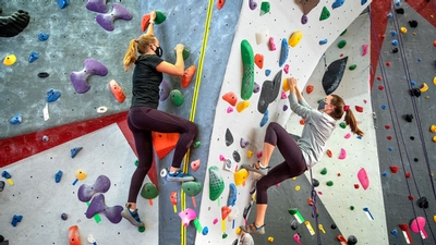 Students rock climb at Lindseth Climbing Center at Cornell University